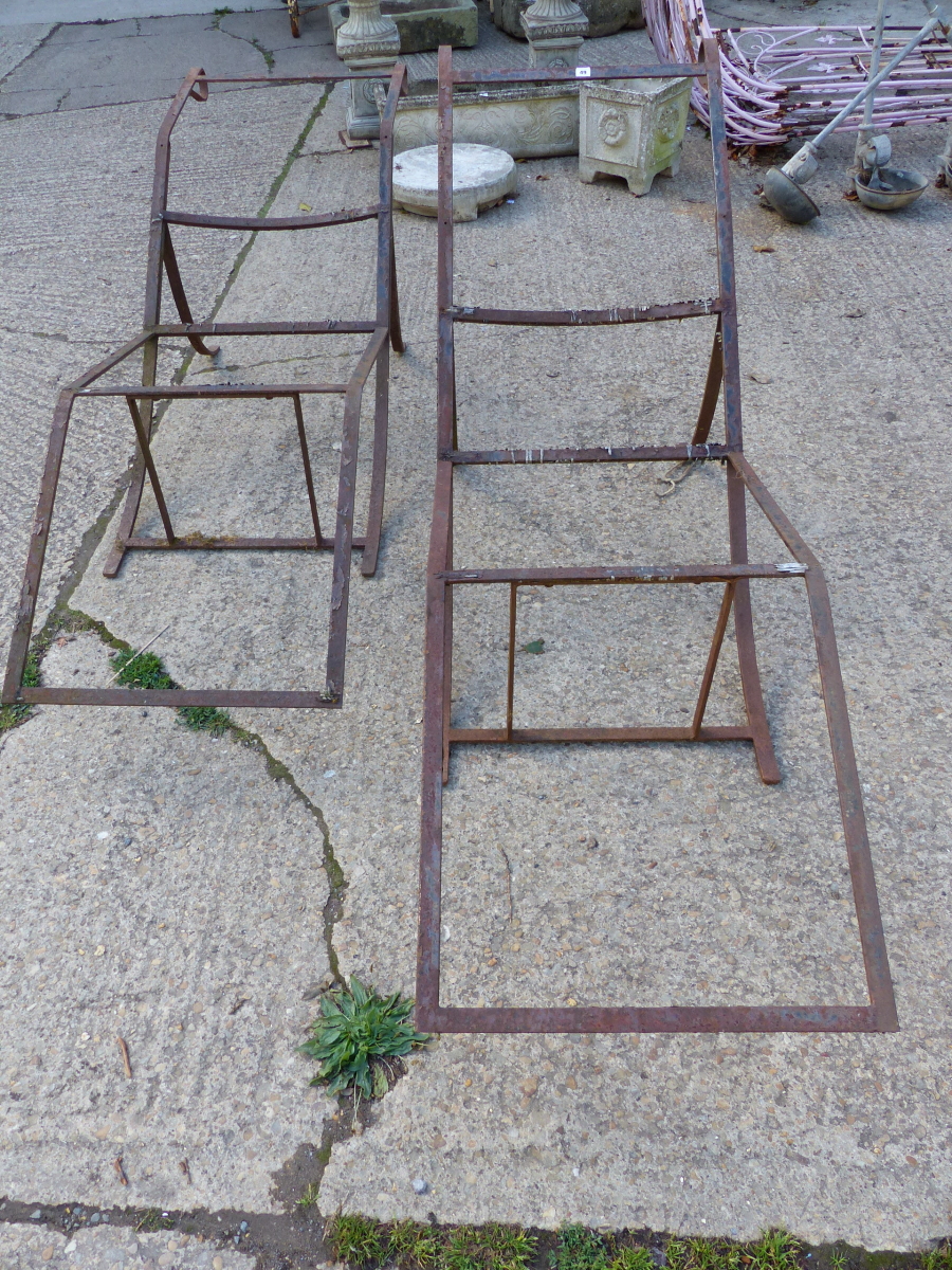 A PAIR OF EARLY IRON LOUNGER FRAMES.