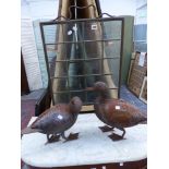 TWO METAL DUCK ORNAMENTS AND A BRASS FRAMED FIRE SCREEN.