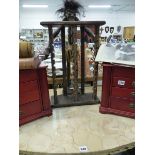 TWO SMALL FOUR DRAWER JEWELLERY CHESTS AND A CD RACK.