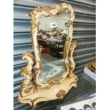 A DECORATIVE DRESSING TABLE MIRROR.