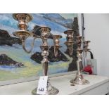 A PAIR OF PLATED CANDELABRA.