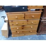 A MODERN PINE CHEST OF DRAWERS AND A BEDSIDE CHEST.