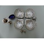 A SET OF FOUR HALLMARKED SILVER PIERCED SHELL FORM DISHES AND A WHITE METAL EGG FORM BOX, TWO