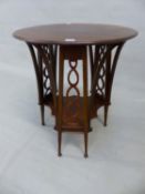 AN INTERESTING ARTS AND CRAFTS SMALL CENTRE TABLE SUPPORTED ON THREE PAIRS OF SPLAY LEGS AND PIERCED