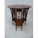 AN INTERESTING ARTS AND CRAFTS SMALL CENTRE TABLE SUPPORTED ON THREE PAIRS OF SPLAY LEGS AND PIERCED