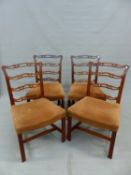 A SET OF FOUR MAHOGANY PIERCED LADDER BACKED CHAIRS, THE UPHOLSTERED SEATS OVER A CHANNELLED FRONT