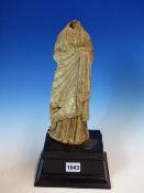 A TANAGRA TERRACOTTA FIGURE OF A HEADLESS LADY, HER BODY CLASSICALLY DRAPED. H 26cms. WITH A WOOD