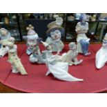 FIVE LLADRO CLOWNS TOGETHER WITH FOUR OTHERS VARIOUSLY POSED, THE TALLEST AND THE WIDEST. 36cms.