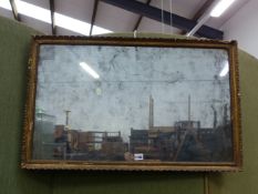 A 19th C. RECTANGULAR MIRROR IN A GILT FRAME WITH A BEADED BAND INSIDE THE GADROONED EDGE. 51 x