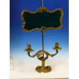 AN ORMOLU FRENCH ADJUSTABLE LAMP ON A SQUARE COLUMN ABOVE TWO FOLIATE CANDLE NOZZLES ABOVE THE ROCOC