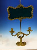 AN ORMOLU FRENCH ADJUSTABLE LAMP ON A SQUARE COLUMN ABOVE TWO FOLIATE CANDLE NOZZLES ABOVE THE ROCOC