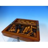A MAHOGANY CASED BOX AND EBONY TRAVELLING CHESS SET, THE BOX OPENING TO REVEAL THE CHESS BOARD,