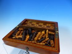 A MAHOGANY CASED BOX AND EBONY TRAVELLING CHESS SET, THE BOX OPENING TO REVEAL THE CHESS BOARD,