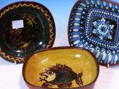 A COLLECTION OF SEVENTEEN 1970S HAMPTON POTTERY SLIP WARE DISHES VARIOUSLY DECORATED WITH STIPPLING,