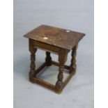A 17th C. AND LATER OAK JOINT STOOL, THE RECTANGULAR SEAT ABOVE AN APRON CARVED WITH STARS ON