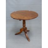 A 19th C. MAHOGANY TILT TOP TABLE, THE CIRCULAR TOP ON TURNED COLUMN