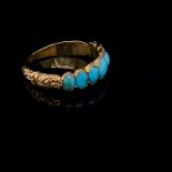 AN ANTIQUE 18ct UNHALLMARKED GOLD AND TURQUOISE GRADUATED HALF HOOP CLOSED BACK RING WITH CARVED