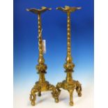 A PAIR OF CHINESE POLISHED BRONZE PRICKET CANDLESTICKS, THE LOTUS LEAF DRIP PANES WITH FROGS TO
