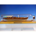 A WINDERMERE STEAMBOAT MUSEUM MODEL OF THE STEAM LAUNCH BRANKSOME MOUNTED WITHIN A BOTTLE ON A