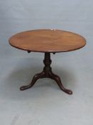 A 19th C. MAHOGANY CIRCULAR TILT TOP TABLE ON BALUSTER COLUMN, CLUB FEET. Dia.100 x H 69.5cms