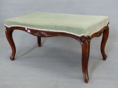 A VICTORIAN MAHOGANY STOOL, THE SEAT UPHOLSTERED IN TURQUOISE VELVET OVER SHELL TOPPED CABRIOLE LEGS