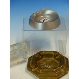 A 1982 BRASS VSOE Inc. OCTAGONAL ASHTRAY. W 14.5cms. AN ALUMINIUM ASHTRAY WITH RACING CAR RIM.