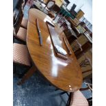 AN EDWARDIAN MAHOGANY D-END DINING TABLE CRANKING OUT TO TAKE THREE LEAVES, THE TAPERING SQUARE L