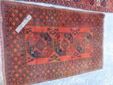 AN AFGHAN RUG, 161 x 107cms. TOGETHER WITH A FLAT WEAVE PANEL, 200 x 102cms.