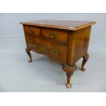 A WALNUT GEORGIAN DESIGN CHEST OF TWO SHORT DRAWERS AND A LONG DRAWER CENTRALLY RECESSED AND INLAID