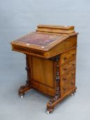 A 19th C. WALNUT DAVENPORT, THE LEATHER INSET FALL BANDED IN YEW WOOD, THE INTERIOR IN MAPLE, FOUR