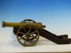 A BRONZE MODEL OF A 1570 CANNON BARREL WITH A TOWER SHIELD BEFORE THE TOUCH HOLE, THE WOODEN GUN