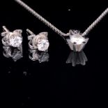 AN 18ct WHITE GOLD DIAMOND PENDANT AND EARRING SET. THE DIAMOND PENDANT IN A SIX CLAW WHITE GOLD