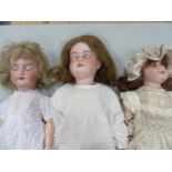 THREE ARMAND MARSEILLE BISQUE HEADED MODEL 390 DOLLS, THE TALLEST. H 65cms.