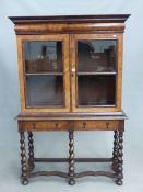 AN ANTIQUE EARLY 18th.C. STYLE WALNUT CABINET ON STAND WITH TWO GLAZED DOORS SHELVED INTERIOR ON A