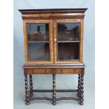 AN ANTIQUE EARLY 18th.C. STYLE WALNUT CABINET ON STAND WITH TWO GLAZED DOORS SHELVED INTERIOR ON A