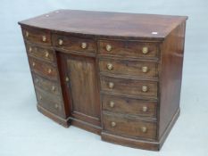 AN EARLY 19TH CENTURYBOW FRONTED SIDEBOARD, THE CENTRAL DRAWER AND RECESSED CUPBOARD FLANKED BY