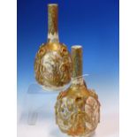 A PAIR OF EARLY 20th C. SATSUMA POTTERY BOTTLE VASES, EACH PAINTED WITH FIGURES ALTERNATING WITH