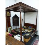 AN ANTIQUE MAHOGANY FOUR POSTER DOUBLE BED, THE FLUTED COLUMNS AT THE FOOT INLAID WITH TREFOIL TOP