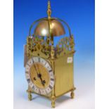 A LANTERN CLOCK WITH JAPY FRERES PLATFORM ESCAPEMENT MOVEMENT STRKING ON A BELL. H 30cms.