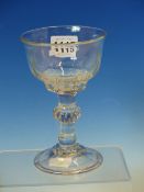 AN 18th C. SWEETMEAT GLASS, THE RIBBED OGEE BOWL ON A CYLINDRICAL STEM WITH BUN SHAPED TEARED KNOP