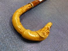 A WALKING STICK WITH MOULDED LURCHER HEAD HANDLE