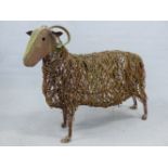 A LIFE SIZE WELDED WIRE SCULPTURE OF A HORNED SHEEP.