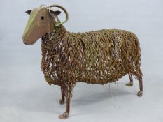 A LIFE SIZE WELDED WIRE SCULPTURE OF A HORNED SHEEP.