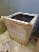 A PAIR OF LARGE TEAK TERRACE PLANTERS.