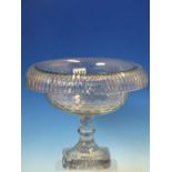 AN IRISH CUT GLASS BOWL WITH TURNOVER RIM, FACET CUT BOWL ON MOULDED KNOPPED STEM AND STAR SQUARE