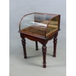 A 19th C. GLAZED MAHOGANY SHOP DISPLAY TABLE, THE FRONT ROUNDED ABOVE TURNED AND TAPERING