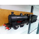 AN UNKNOWN GAUGE 1 LOCOMOTIVE AND TENDER LNER 0-6-0 NO. 4199 IN A TRANSIT CASE.