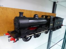 AN UNKNOWN GAUGE 1 LOCOMOTIVE AND TENDER LNER 0-6-0 NO. 4199 IN A TRANSIT CASE.