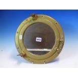 A BRASS PORTHOLE NOW FITTED WITH MIRRORED GLASS, THE FRAME. Dia. 30cms.