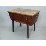 AN ANTIQUE OAK DOUGH BIN, THE SINGLE PLANK TOP AND JOINTED SIDES ON SHAPED SQUARE SECTIONED LEGS.